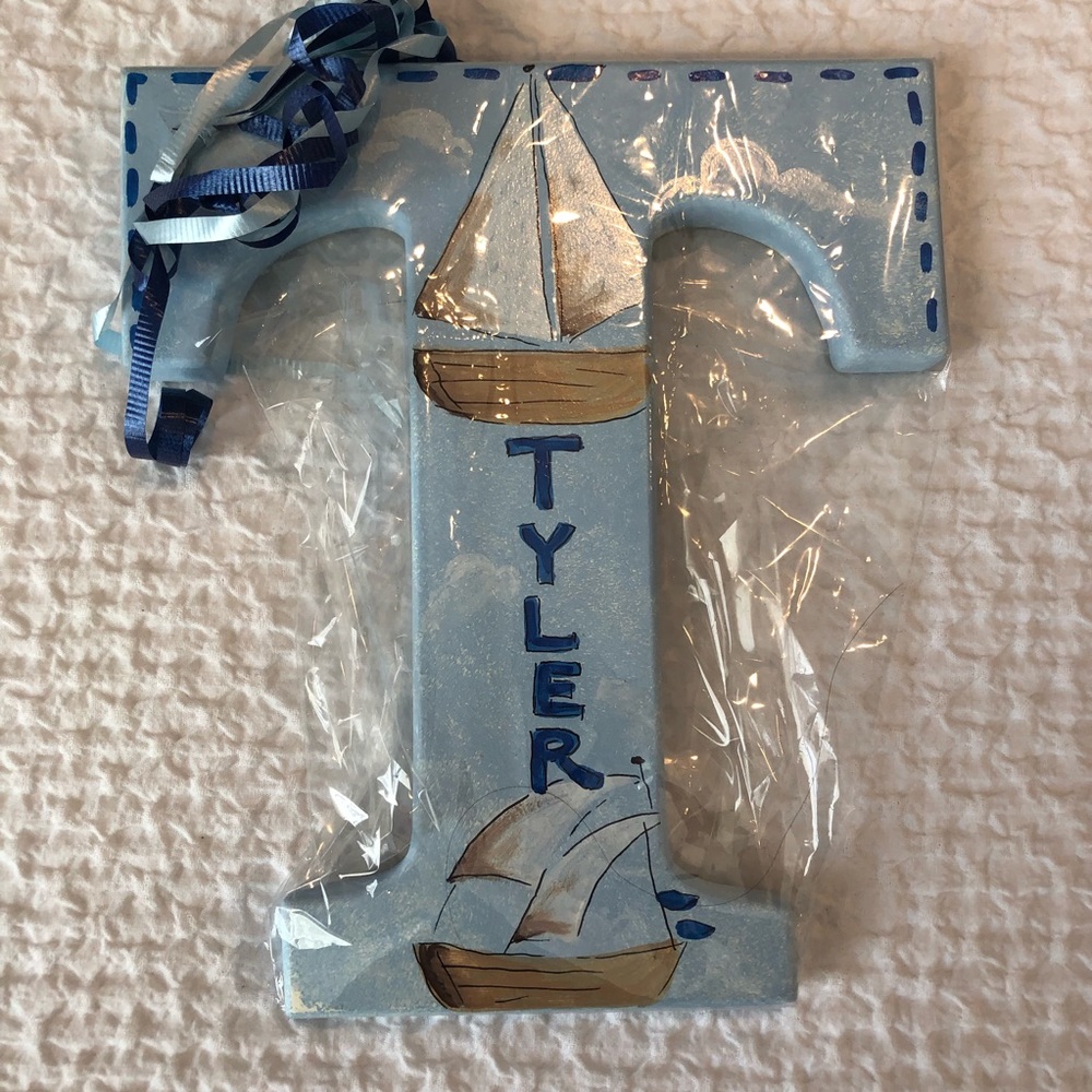 Handcrafted T with the name TYLER